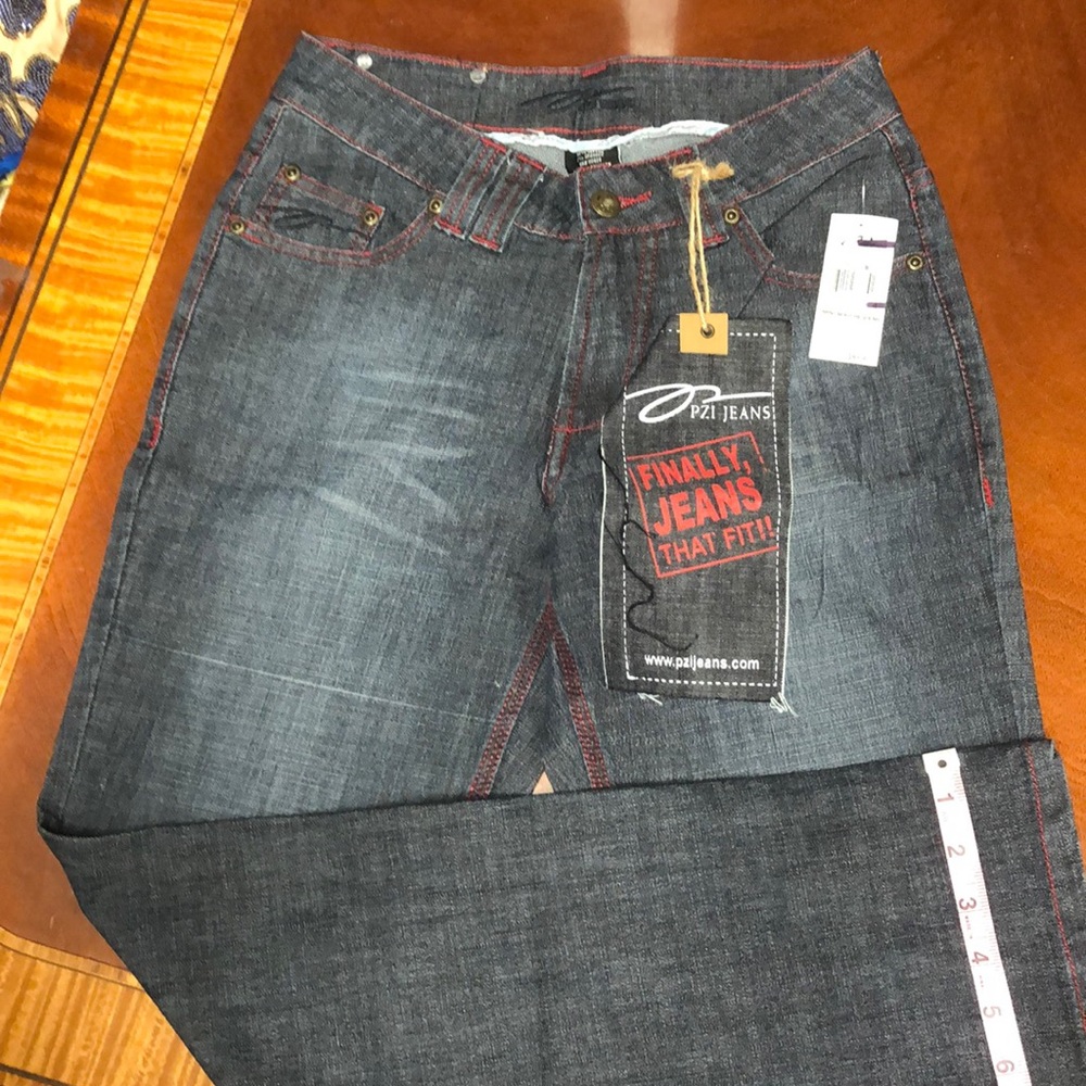 PZI jeans denim jeans has red stitching on seams